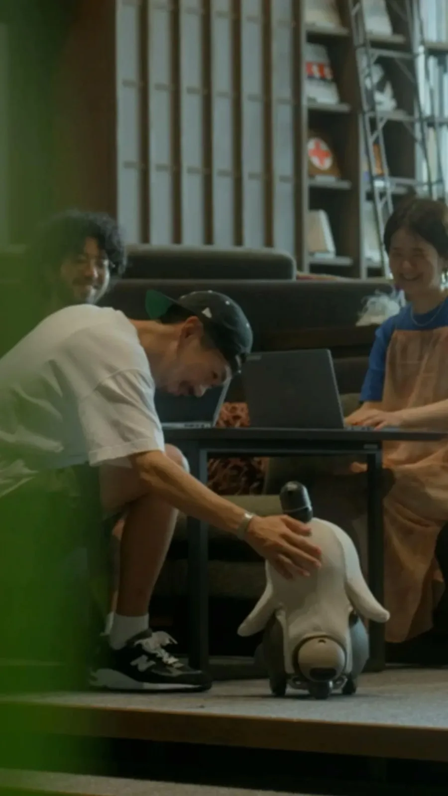 A family with a LOVOT robot at home