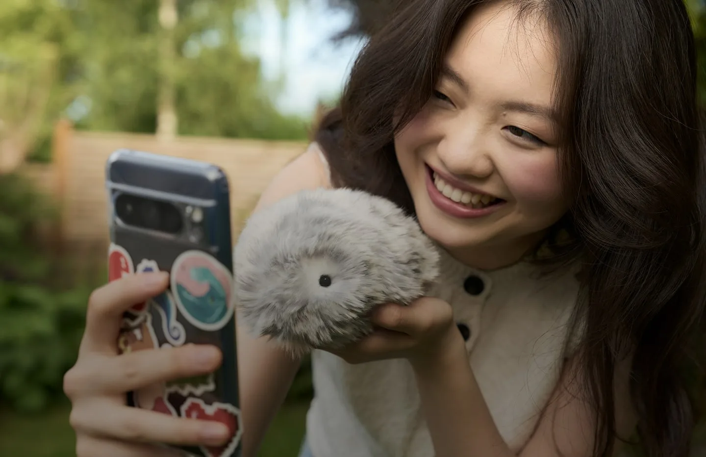 A woman with a Moflin and the MofLife companion app